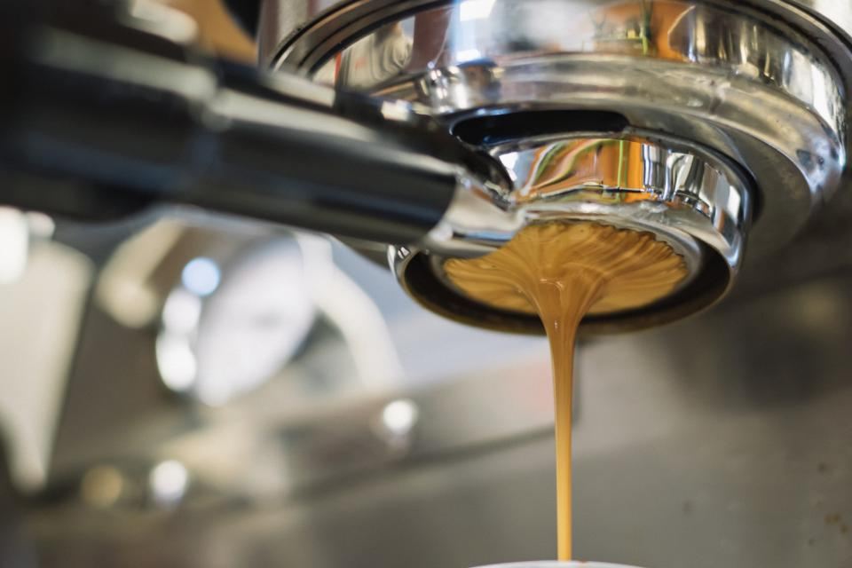 Espresso pouring from a portafilter