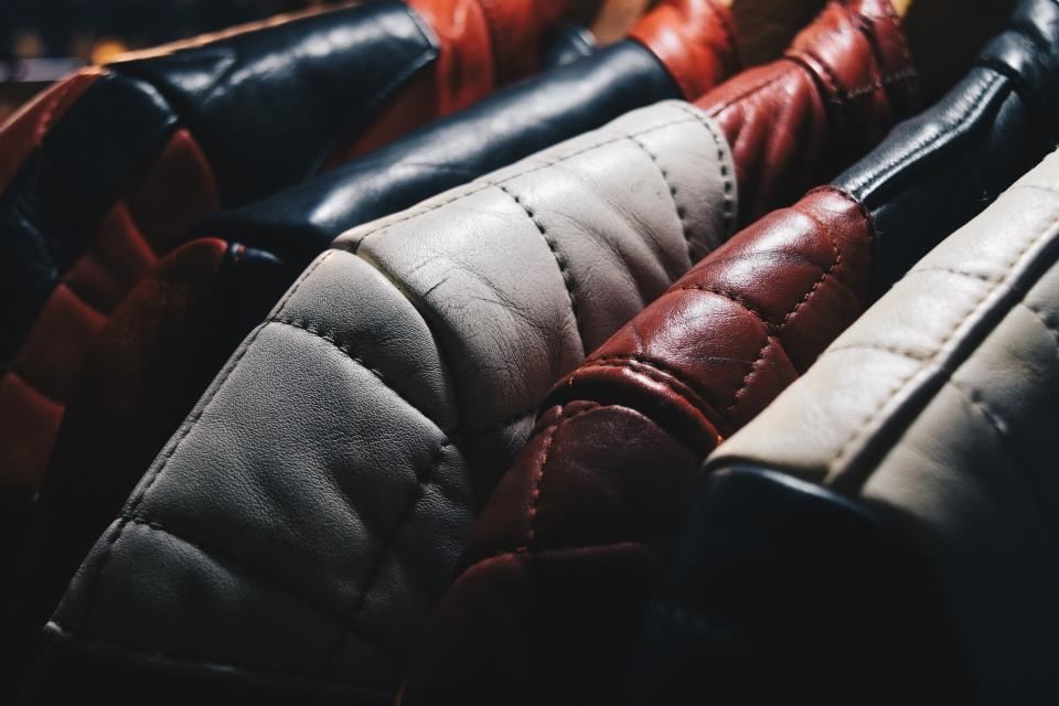 Quilted leather moto jackets on a rail