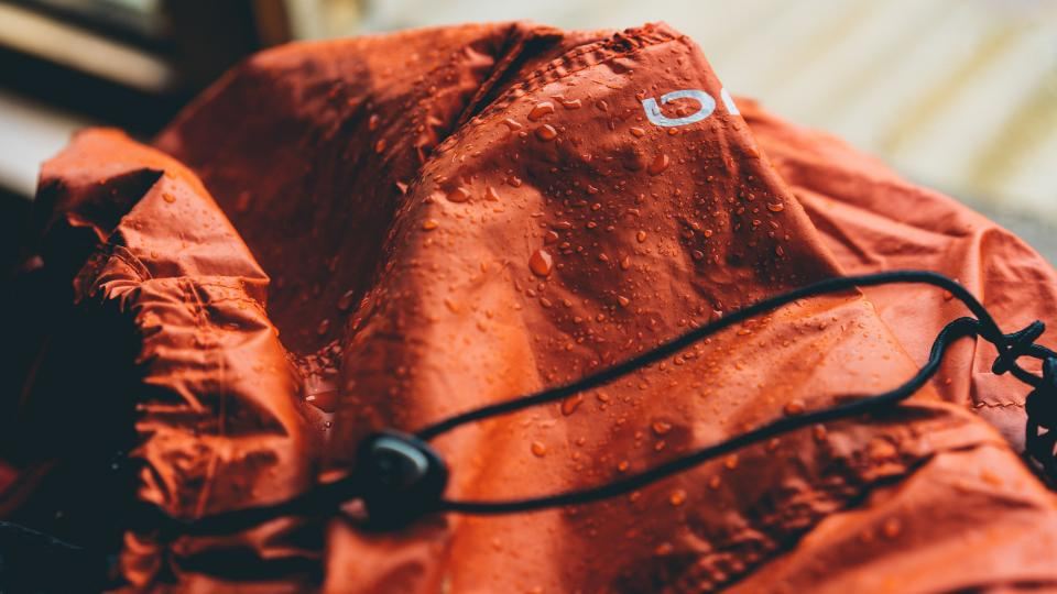 Rust waterproof puffer jacket detail
