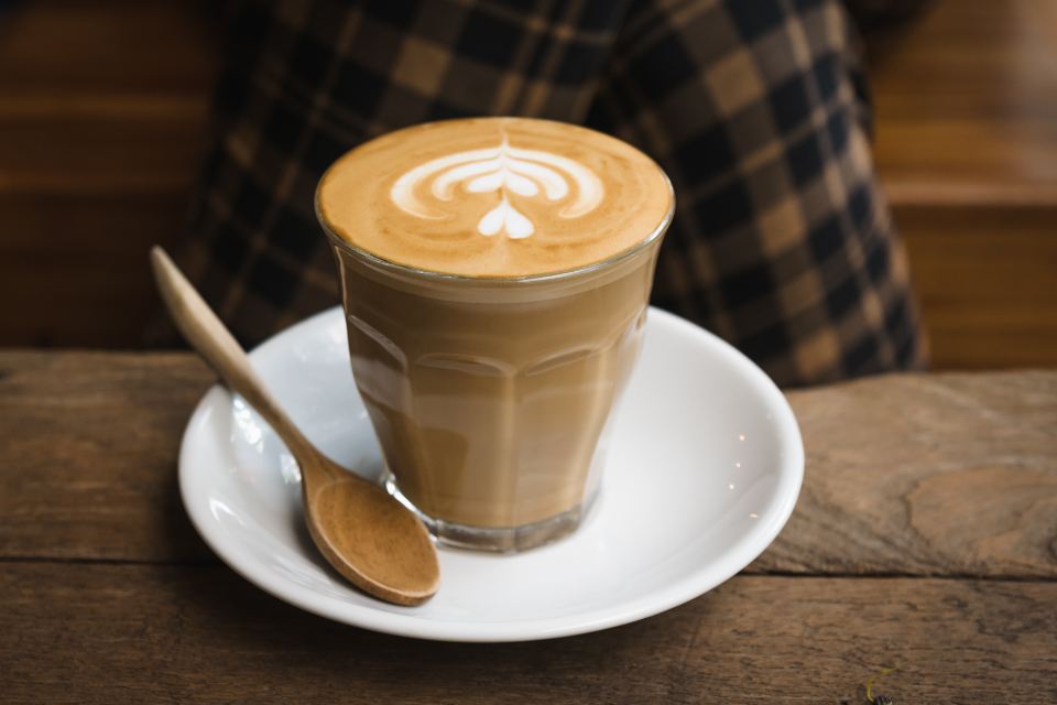 Cortado in a glass with a spoon