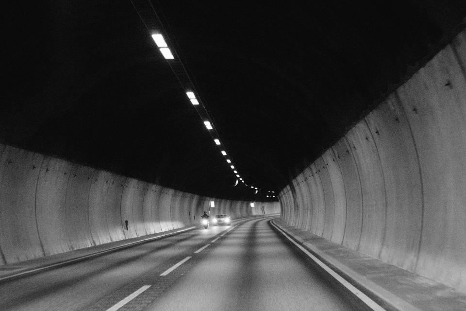 Long lit road tunnel