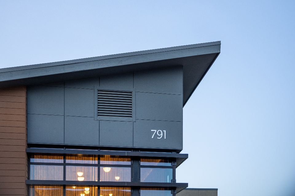 The top floor of a modern low-rise tower with a sloping roof