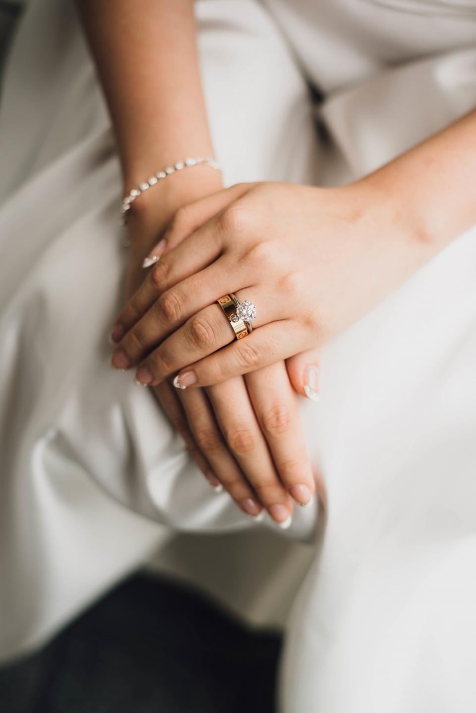 Bride's hands with an engagement ring