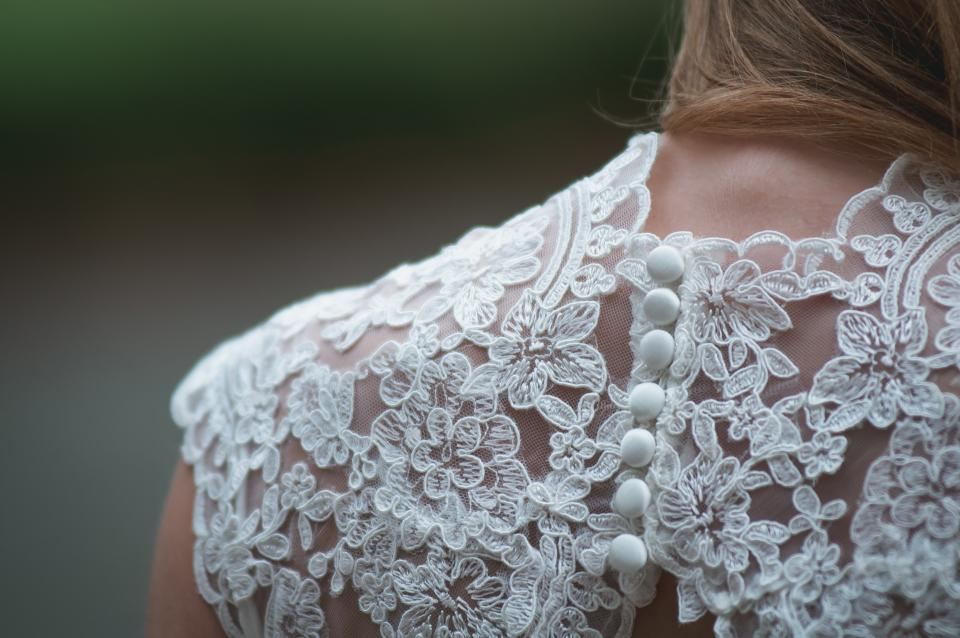 Lace back and buttons of a wedding gown