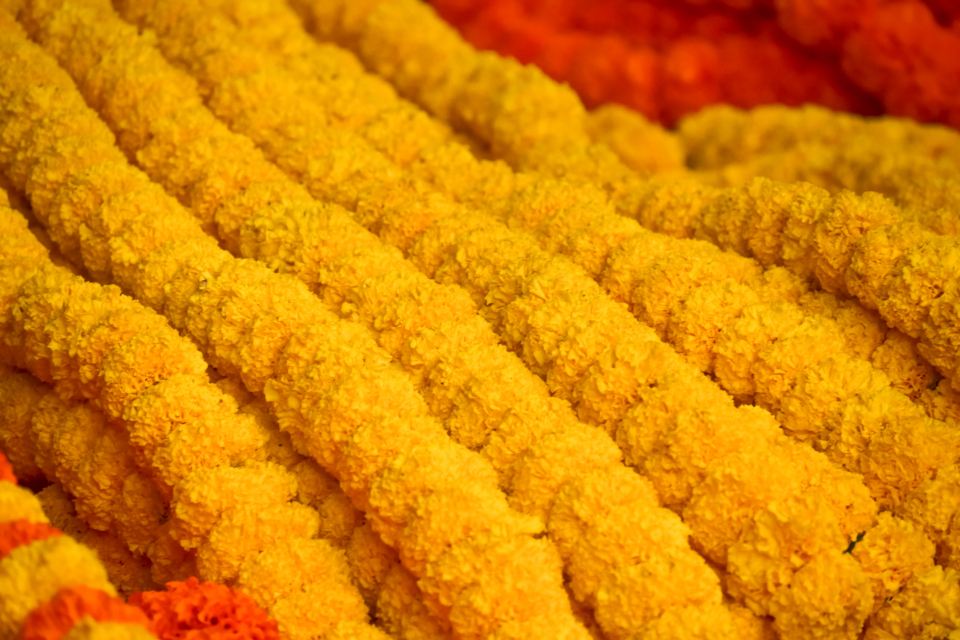 Rows of orange and yellow marigold garlands