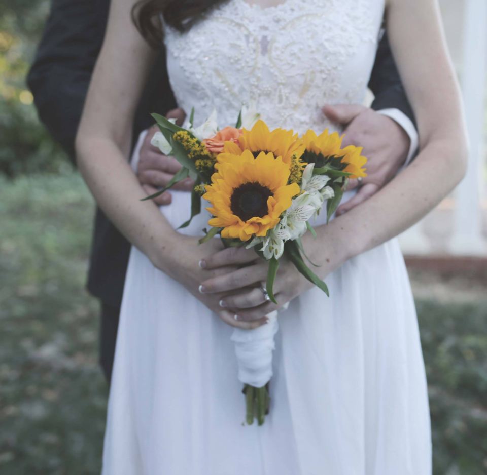 Bride holding a sunflower bouquet